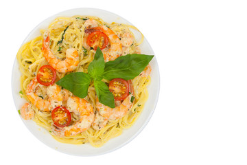delicious delicious spaghetti with shrimps and basil on  plate