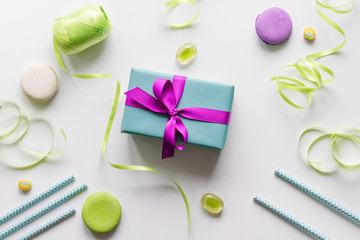 Gift box with colorful party items white background top view