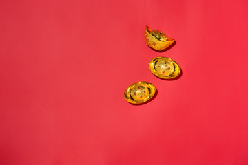 Chinese new year decorations on red background with gold spots.