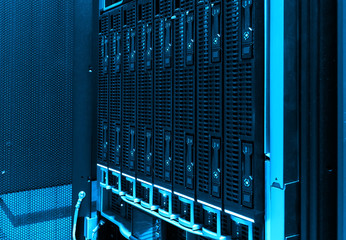 close-up of hard drives in modern data center. blue tone