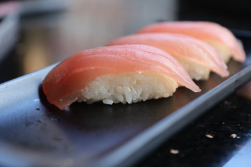 Three tuna nigiri