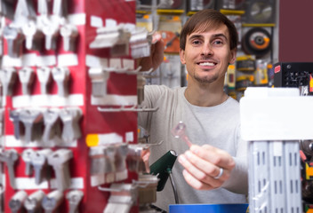 Friendly professional with different types of keys