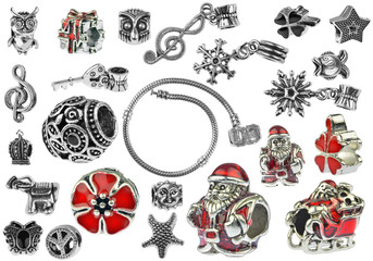 Small silver charm bracelet with many charms isolated on white background, clipping paths included