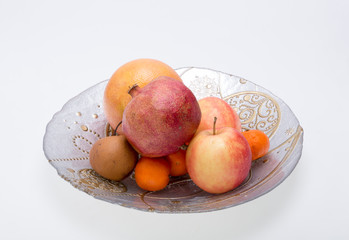 mix fresh fruits on plate isolated on white