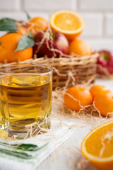 Fototapeta na wymiar Oranges, apples and fresh juice on a light background