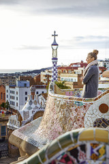 Fototapeta premium tourist woman at Guell Park in Barcelona looking into distance