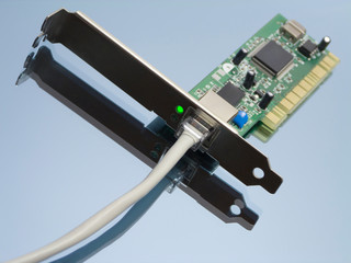 Online concept with ethernet network interface, attached cable and green lit led light on...