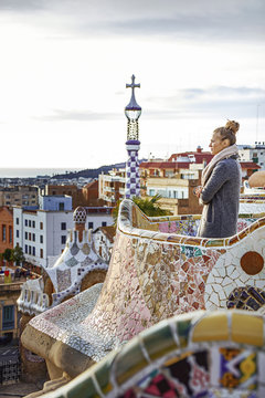 tourist woman at Guell Park in Barcelona looking into distance