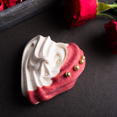 Homemade meringues in heart shape for Valentine's day, top view.