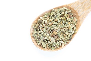 dried oregano in wooden spoon