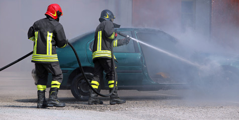 Firefighters extinguished the fire at a car