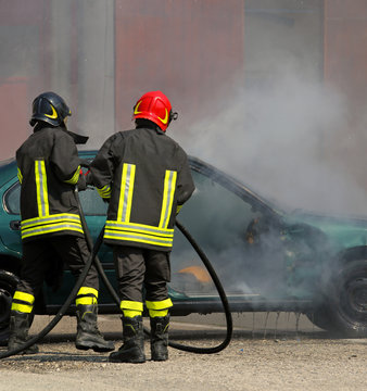 Firefighters extinguished the fire at a car after the traffic ac