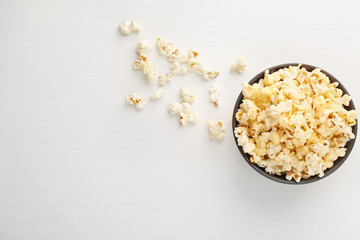 Popcorn in bowl on white background