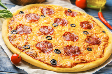 Tasty pizza with cheese, olive and pepperoni slices, closeup