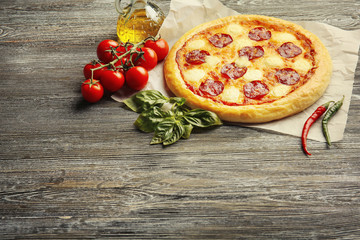 Homemade pepperoni pizza on wooden table