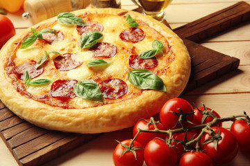 Homemade pepperoni pizza on wooden table