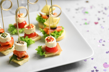 Assorted canapes on table closeup