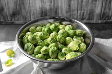 Brussels sprouts in metal bowl on napkin