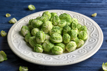 Plate with brussels sprouts on wooden table © Africa Studio