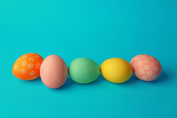 Colorful Easter eggs on blue background