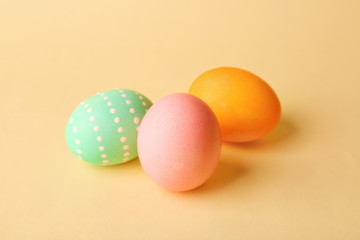 Colorful Easter eggs on yellow background