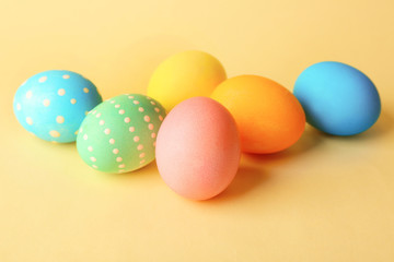 Fototapeta na wymiar Colorful Easter eggs on yellow background