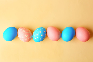 Colorful Easter eggs on yellow background