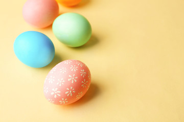 Colorful Easter eggs on yellow background