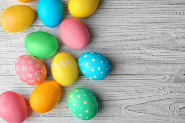 Colorful Easter eggs on wooden table