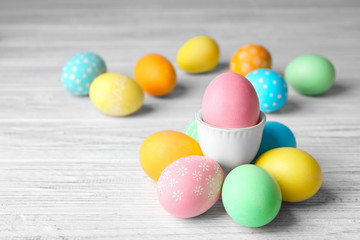 Fototapeta na wymiar Colorful Easter eggs on wooden table