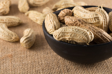 Closeup boiled peanuts in black cup, street food of Thailand.