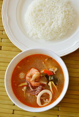boiled seafood and pork tom yum Thai spicy soup eat with rice