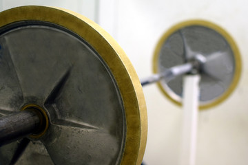 Close up of barbell at the gym. Focus on foreground.
