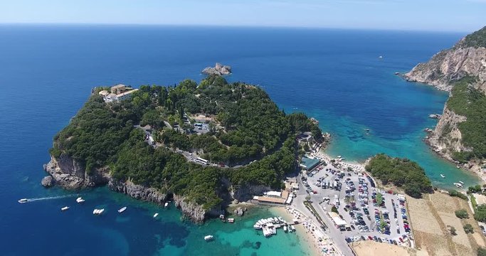 Corfu Paleokastrita bay with clear blue waters. Aerial footage from a drone. Kerkyra Island, Greece.