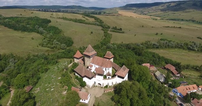 Viscri fortified church in the german Saxon village of Viscri in Transylvania. Aerial view from a drone