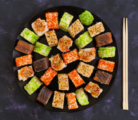 Sushi roll on dark background. Top view