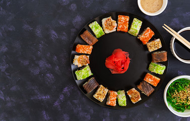 Sushi roll on dark background. Top view