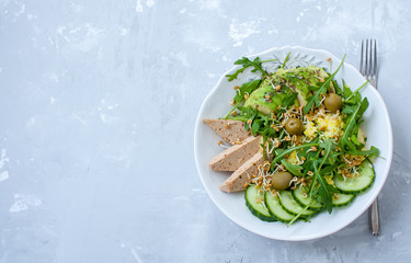 Green salad with avocado, couscous and tofu. Love for a healthy raw food concept.