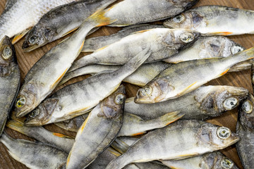 Dried fish on wooden background