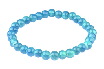 Blue elastic bracelet made of small pearl-like round beads, isolated on white background, clipping path included