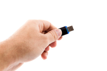 man hand holding flash drive isolated on white background