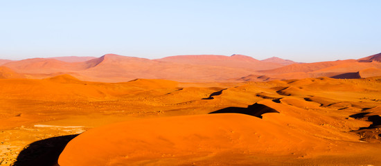 Red dunes of Namib Desert near Sossusvlei, aka Sossus Vlei, Namib-Naukluft National Park, Namibia, Africa.