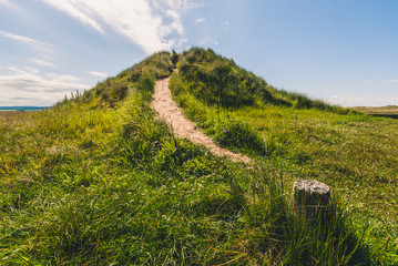 Path up grassy mound