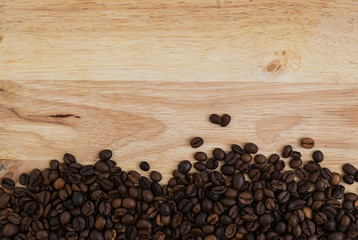 Mixture of different kinds of coffee beans on wooden background. Coffee background