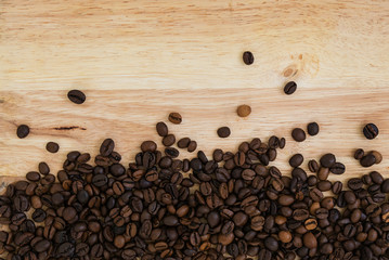 Mixture of different kinds of coffee beans on wooden background. Coffee background