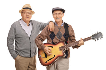Fototapeta premium Cheerful seniors playing a guitar