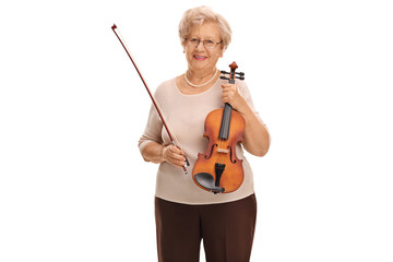 Elderly woman holding a violin and a bow