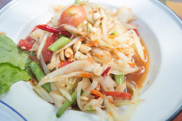 Green papaya salad is a spicy salad made from shredded unripe papaya. It is of Lao origin but it is also eaten throughout Southeast Asia.
