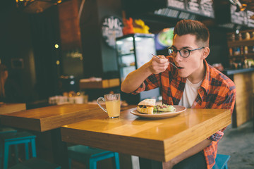 Man eating in a restaurant and enjoying delicious food