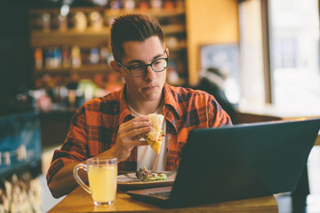 Man eating in a restaurant and enjoying delicious food